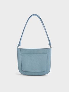 This item is part of our Online Exclusive selection, which consists of unique colourways and designs that are only available for purchase at CHARLESKEITH.COM.This product is made with at least 20% sustainable materials by weight. CHARLES & KEITH uses recycled, degradable, organic, and water-based materials in our eco-conscious collection.A denim bag just completes any outfit with an effortlessly cool vibe. This iteration features an angular, boxy shape that is both sturdy and structured, alongsi Modern Denim Blue Shoulder Bag For Everyday, Modern Denim Blue Bag For Everyday Use, Casual Blue Shoulder Bag With Flat Pocket, Modern Denim Blue Shoulder Bag, Modern Everyday Denim Shoulder Bag, Modern Denim Shoulder Bag For Everyday, Versatile Denim Bag, Versatile Everyday Denim Bag, Denim Bag For Everyday