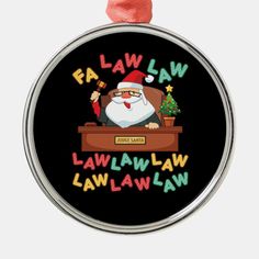 a christmas ornament with an image of santa clause sitting at a desk in front of