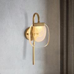 a light that is on the side of a wall next to a window with curtains