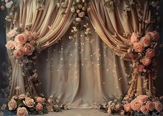 an elaborately decorated stage with flowers on it's sides and lights coming from the curtain