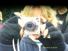 a woman taking a photo with her camera