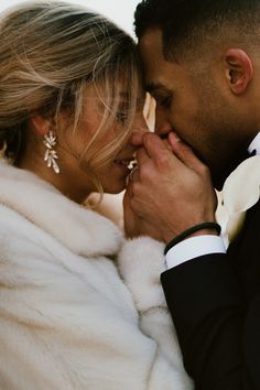 a bride and groom are posing for a photo