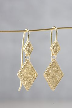 Gold Dangle Earrings with Ethnic Design, Solid Gold Drop Earrings Art Deco Style, 14k/18k Gold Elegant Earrings, Unique Gold Jewelry ----------------- Features: ♥ Gold ethnic dangle earrings. ♥ Floral beautiful engraving. ♥ 14k / 18k gold. ♥ Yellow/Rose/White gold. ♥ LiatGilad jewelry is made of high-quality materials. ♥ Arrives in an elegant gift package. Sizes: ♥ Length: 1.37 inch  //  3.5 cm ♥ Ear wire thickness:  0.0394 inch // 1 mm ❤ All of my jewelry is 100% handmade with love and attentio Trend Forecast, Engraved Earrings, Long Gold Earrings, Bridal Earrings Drop, Gold Bridal Earrings, Earrings Art, 18k Gold Earrings, Gold Dangle Earrings, Gold Statement Earrings