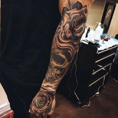 a man with a tattoo on his arm