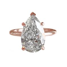 a pear shaped diamond engagement ring in rose gold