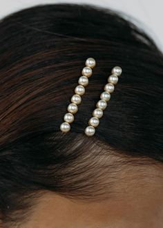 The Gracie Bobby Pins are a wardrobe staple. This set of two features rows of hand bezel-set Swarovski pearls, for a sweet yet sophisticated finishing touch. When it comes to bobby pins, more is more: don't be afraid to layer on multiple sets, or mix with the Gwen Bobby Pins and Perla Bobby Pins. Product Details Hand bezel-set Swarovski pearls. Steel bobby pins. Made in the USA. Care Instructions Store in dust bag. Avoid contact with water, perfume, and other chemicals, including hairspray, whic Hair Side Twist Bobby Pins, Wedding Hair Down Pearl Pins, Hair Grips Bobby Pins, Hair Clips Cute Bobby Pins, Pearl Hair Pins Bride, Hair Accessories Debbie Carlisle, Stick On Pearls For Hair, Gabby Bachelorette Hair, Pearl Bobby Pins Hairstyle