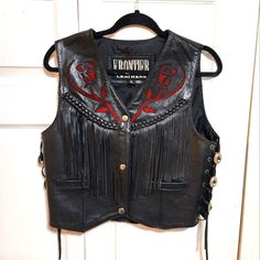 Genuine Leather Ladies Motorcycle Vest With Fringe Design And Red Rose Cut Out. New Without Tags. Has Extra Snaps. Size Medium. Approximate Measures Are From Back Shoulder To Shoulder 14 Inches. Front Length 19 And 1/2 Inches. From Armpit To Armpit In The Front Measurement Is Approximately 19 In.. Depending How You Like Your Fit, It Can Fit Up To 39" Breast Measurement. I Am 36 And It Fits Nice Too Black Fitted Western Outerwear, Fitted Black Western Outerwear, Ladies Motorcycle, Biker Women, Leather Vests, Brown Puffer, Black Leather Vest, Motorcycle Vest, Womens Puffer Vest