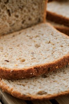 sliced bread sitting on top of a wooden cutting board