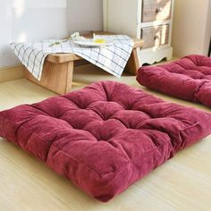 two futon mattresses sitting on the floor next to each other