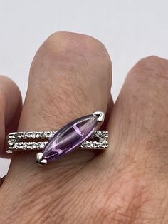 Unusual amethyst  ring Sterling setting handmade  Size 8 can be re sized for you.  My jeweler charges $20 Sterling Silver is rhodium finished to prevent tarnish All rings are shipped in a nice gift box.   Check out our over a THOUSAND great reviews Engraving is $4 per letter and is not always perfect depending on the piece. It can take a few days if the jeweler is busy. This is payable to Paypal Judithsltd@gmail.com Vintage Adjustable Amethyst Ring In Sterling Silver, Sterling Silver Heart-shaped Amethyst Ring, Sterling Silver Multi-stone Amethyst Ring, Vintage Purple Heart-shaped Jewelry, Vintage Silver-toned Amethyst Ring Gift, Amethyst Heart, Vintage Jewelry Sets, Vintage Purple, Vintage Jewels