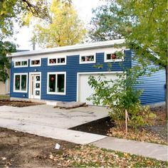 a blue house with white trim and windows