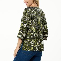 Colleen Lopez Woven Relaxed Fit Printed Top  This easy-breezy woven top features an amazing print that's sure to complement your style. It perfectly pairs with just about any pant, legging or skirt. Green V-neck Top With Vibrant Print, Patterned Abstract Print V-neck Top, Trendy Green Printed Top, Vibrant Print Tops For Vacation, Green Bohemian Top With Graphic Print, Floral Print Crew Neck Blouse For Vacation, Vacation Blouse With Floral Print And Crew Neck, Vacation Floral Print Crew Neck Blouse, Green Graphic Print Blouse With Relaxed Fit