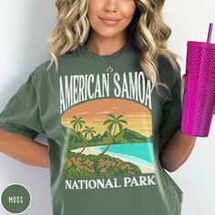 "Show off your love of American Samoa and its majestic green shores with our American Samoa National Park Shirt! This shirt makes a great family vacation trip shirt, and is all about embracing the great outdoors! It features a custom vintage design that showcases the beauty of the Samoan coast with lush palm trees and crystal blue ocean. The \"comfort colors\" garment-dyed vintage cotton fabric has that comfy, lived-in feel, that's like a hug every time you put it on! Now you can take a bit of American Samoa with you wherever you go! Grab one now and hit the trail (or the beach)! PLEASE NOTE This is a standard unisex size Comfort Colors Tee. For an oversized tee, please size up. If you are looking for an oversized \"T-shirt Dress\" look, we recommend sizing up 2 sizes. Please review the si American Samoa, National Park Shirt, National Park Gifts, Oversized T Shirt Dress, Dye Shirt, Mountain Designs, American Shirts, Comfort Colors Tee, Travel Shirts