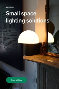 a lamp that is sitting on top of a table in front of a mirror with the words small space lighting solutions above it