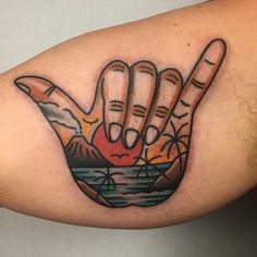 a person with a tattoo on their arm and hand