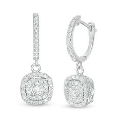 Complement her romantic look with these sparkling diamond drop hoop earrings. Crafted in 14K white gold, each earring dangle features a 1/8 ct. diamond wrapped in a round and cushion-shaped diamond frame. The ear wires also shimmer with diamonds. Radiant with 7/8 ct. t.w. of diamonds and a bright polished shine, these hoops secure with hinged backs. Diamond Dangle Hoop Earrings Fine Jewelry, Dangle Diamond Hoop Earrings Fine Jewelry, Fine Jewelry Diamond Dangle Earrings With Halo Setting, White Gold Halo Design Dangle Diamond Earrings, Fine Jewelry Dangle Hoop Earrings With Halo Design, Diamond Dangle Hoop Earrings, Diamond Cut Dangle Hoop Earrings, Diamond-cut Dangle Hoop Earrings, Diamond-cut Dangle Hoop Earrings In Diamond