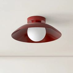 a red and white light hanging from the ceiling