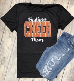 Cheer Team, Cheer Mom, Team Pride, School Spirit, Cheer Mom, Cheerleading Squad Shirt, School Colors, Tumbling, Dance, Unisex Fit Glitter Unisex Fit Tee (Shown in Black) Colors are customizable. Glitter Vinyl (Orange Glitter with matte white shown.) All materials used are high quality, professional grade. Please check shop updates for current turnaround times! Competition Cheer Shirts, Casual Glitter Print Tops For Cheerleading, Short Sleeve Glitter Print Top For Cheerleading, Short Sleeve Top With Glitter Print For Cheerleading, Black Glitter Print Tops For Cheerleading, Black Glitter Print T-shirt For Cheerleading, Cheerleading T-shirt With Glitter Print Crew Neck, Cheerleading Glitter Print Crew Neck T-shirt, Black Top With Letter Print For Cheerleading