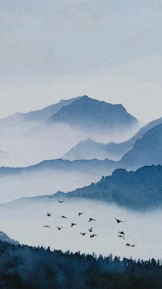 watercolor painting of birds flying in the sky over mountains and foggy forest area