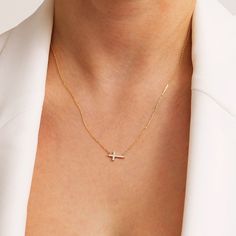 1- P R O D U C T ∙  D E S C R I P T I O N The Diamond Pave Cross Necklace in 14K Real Gold is a beautiful piece of religious jewelry that is perfect for women of all ages. The sideways cross pendant is crafted from 14k real gold and is embellished with a sparkling diamond pave design, making it a truly eye-catching piece of jewelry. The pendant is suspended from a delicate 14k gold chain, making it a durable and long-lasting piece of jewelry that will be treasured for years to come, symbolizing Minimalist Cross Pendant Necklaces For Baptism, Minimalist Cross Pendant Necklace For Baptism, 14k Gold White Cross Necklace As Gift, White 14k Gold Cross Necklace As Gift, White 14k Gold Cross Necklace Gift, White 14k Gold Cross Pendant Necklace, Minimalist Cross Jewelry For Baptism, Elegant Yellow Gold Necklace For Baptism, Classic White Gold Jewelry For Baptism