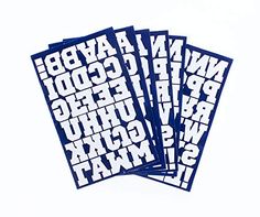 four blue stickers with white letters on them