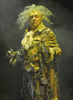 a man dressed in chains and yellow clothing