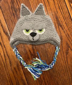 a crocheted hat with a cat's face on it