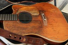 an old ukulele is sitting in its case and ready to be used as a musical instrument