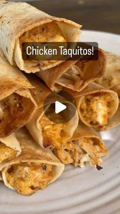 chicken taquitos on a white plate with the words chicken taquitass