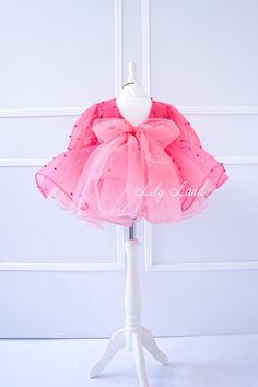 Looking for the perfect outfit for your little princess's special occasion? Look no further than our stunning Dress! Perfect for flower girls, birthdays, and other special occasions, this dress is sure to make your little girl feel like a true princess. Made with high-quality materials, this toddler dress is not only beautiful but also comfortable for your little one to wear. The soft and breathable fabric ensures that your baby girl will feel comfortable and happy all day long, whether she's po Spring Princess Tutu Dress With Bow, Spring Princess Style Tutu Dress With Bow, Spring Princess Dress With Pink Bow, Pink Bow Dress For Dress-up, Pink Tulle Dress With Bow, Party Princess Dress With Pink Bow, Sweet Spring Princess Dress For Wedding, Sweet Spring Princess Wedding Dress, Sweet Spring Wedding Princess Dress