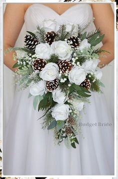 Planning a winter wedding? Look no further! Discover 6 breathtaking outdoor winter wedding ideas that will make your celebration truly magical. From cozy fire pits to twinkling fairy lights, these enchanting ideas will create a romantic and unforgettable atmosphere for your special day. Embrace the beauty of the season and create memories that will last a lifetime. Get inspired now! Sage Wedding Bouquet Brides, Simple Christmas Wedding Bouquet, Winter Wedding Bouquet With Pinecones, Wedding Bouquet With Pinecones, White And Green Winter Wedding Bouquet, Winter Wedding Flower Bouquets, Green Fall Wedding Bouquet, Pinecone Wedding Bouquet, All Green Bouquet