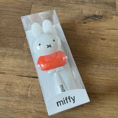 an inflatable animal toy sitting on top of a wooden floor next to a package