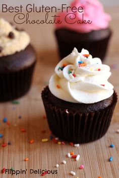 chocolate cupcakes with white frosting and sprinkles