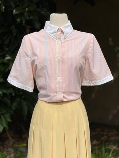 Vintage Multi Pastel Colored Striped Button-Up Collared Short Sleeve Blouse  -Velcro Collar -Solid white trim -Colors: White, pink, blue, yellow  No marked size. Please go by measurements. Measurements (laid flat, not doubled): Shoulder to shoulder: 16" Underarm to underarm: 23" Hem across: 24" Full length: 26" Condition: Excellent! Fitted Blouse With Placket For Daywear, Spring White Blouse With Striped Collar, Fitted Top With Contrast Collar For Spring, White Blouse With Striped Collar For Spring, White Striped Collar Button-up Blouse, White Button-up Blouse With Striped Collar, Fitted Button-up Top With Contrast Collar, Fitted Tops With Contrast Collar And Button-up, Fitted Shirt With Striped Collar For Spring