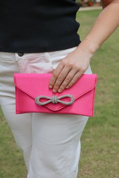 Look dazzling and stylish with this eye-catching Fancy Clutch with Bow. Not only will your outfit stand out, but you'll be sure to turn heads wherever you go! A must-have accessory for any event or occasion. Comes with a purse strap! Glamorous Summer Evening Bag, Chic Pink Evening Bag For Party, Chic Pink Party Clutch, Glamorous Summer Evening Bag For Events, Trendy Evening Bag For Formal Occasions, Pink Rhinestone Clutch For Party, Pink Rhinestone Party Clutch, Pink Evening Bag For Summer Formal Occasions, Pink Evening Bag For Summer Formal Events