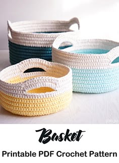 three crocheted baskets sitting on top of a white table next to each other