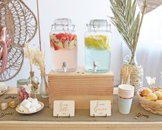 a table topped with mason jars filled with food