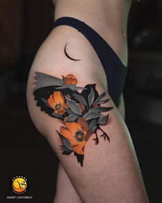 a woman's thigh with flowers on it and a crescent moon in the background