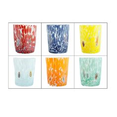 four different colored glass vases sitting next to each other