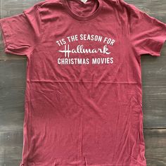 a red t - shirt that says tis the season for hallmark christmas movies