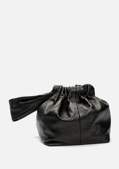 This beautiful Mariposa Bucket Bag captivates with its stunning metallic black hue and soft Italian lambskin leather. Enjoy the chic ruched look that gathers to cleverly close, plus a soft leather handle to carry on your wrist. Whether a special occasion or a spur of the moment adventure, its unique style will ensure you look and feel great! 6" x 6"w, 7" h Made in Los Angeles, CA Elegant Black Top Handle Pouch, Chic Black Pouch With Top Handle, Chic Black Top Handle Pouch, Soft Leather Party Pouch Bag, Soft Leather Pouch Bag For Party, Leather Top Handle Clutch For Party, Black Leather Evening Pouch, Party Evening Bag With Handle Drop In Leather, Elegant Textured Leather Pouch