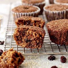 muffins cooling on a wire rack with raisins