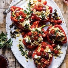 stuffed tomatoes with rice and herbs on a plate