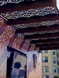 an outdoor area with a television and some buildings in the background