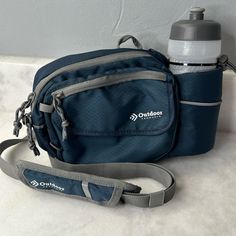 Outdoor Products Shoulder Bag/ Fanny Or Waist Pack With 600ml Water Bottle Never Used But No Tags. Questions? Leave A Comment Below! Functional Navy Shoulder Bag For Outdoor, Navy Functional Shoulder Bag For Outdoor, Blue Bags With Functional Pockets For Outdoor Use, Blue Outdoor Bags With Functional Pockets, Outdoor Blue Bags With Functional Pockets, Sporty Blue Bag With Water Bottle Pocket, Functional Blue Shoulder Bag With Pockets, Blue Multifunctional Sports Bag, Multifunctional Blue Sports Bag