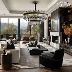 a living room filled with lots of furniture and a chandelier hanging from the ceiling