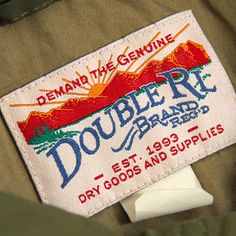 a label on the back of a jacket that says double r brand, dry goods and supplies