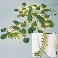 a string of green leaves with white lights