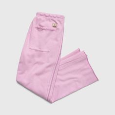 Product Description: Liz Fleece Pant Our ultra-soft Liz Fleece Pant is an essential for cooler days. A lounge essential designed in a vibrant pink hue and featuring side pockets & two back pockets. Comfy enough to stay in, stylish enough to leave the house. Pair with our Ali Washed Hoodie or Ani Sleeveless Sweatshirt for a perfectly matching sweat set. Product Details: Color: Pink Lavender Incredibly Soft Cotton Fabric Drawstring Waist Side Pockets Rear Pockets Surfside Signature Patch Materials Matching Sweat Set, Washed Hoodie, Sleeveless Sweatshirt, Matching Sweats, Sweat Set, Pink Lavender, Beach Lifestyle, Fleece Pants, Recycled Cotton