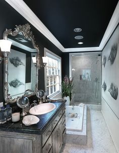 a bathroom with two sinks and a bathtub next to a walk - in shower